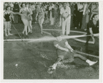 Amusements - Midway Activities - Girl at tug of war, sprayed by hose