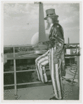 Amusements - Midway Activities - Uncle Sam - On roof, Perisphere and Trylon in background