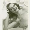 Amusements - Performers and Personalities - Constance Moore in white lace dress
