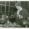 Amusements - Performers and Personalities - Lotte Lehman examines pottery at Danish Pavilion
