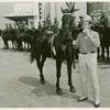 Amusements - Performers and Personalities - Gene Autry with horse eating hotdog