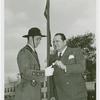 Amusements - Performers and Personalities - Arnold E. slipping coin to Fair patrolman