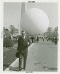 Amusements - Performers and Personalities - Walter Huston in front of Trylon and Perisphere