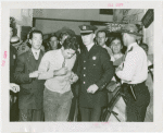 Amusements - Performers and Personalities - Bradshaw, Russell - Under arrest with policemen