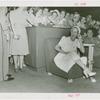 Amusements - Performers and Personalities - Lamour, Dorothy - Laughing as listens to headset