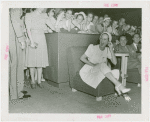 Amusements - Performers and Personalities - Lamour, Dorothy - Laughing as listens to headset