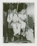 Amusements - Performers and Personalities - Lamour, Dorothy - Riding parachute jump