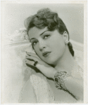 Amusements - Performers and Personalities - Lee, Gypsy Rose - On sofa