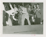 Amusements - Performers and Personalities - Musicians - Louis Prima playing trumpet for dancers