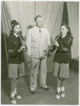 Amusements - Performers and Personalities - Musicians - Two girls playing clarinet while man looks on