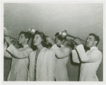 Amusements - Performers and Personalities - Musicians - Men playing trumpet and woman