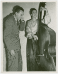 Amusements - Performers and Personalities - Musicians - Woman playing cello, man listens