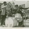 Amusements - Performers and Personalities - Musicians - Krupa, Gene and Algerian Drummers - Krupa leads orchestra as drum contest participant plays