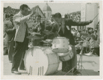 Amusements - Performers and Personalities - Musicians - Krupa, Gene and Algerian Drummers - Krupa leads orchestra as drum contest participant plays