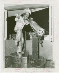 Amusements - Performers and Personalities - Robinson, Bill - In costume, peering through telescope