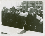 Amusements - Shows and Attractions - Frank Buck's Jungleland - Harvey Gibson playing game, Frank Buck observes