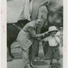 Amusements - Shows and Attractions - Frank Buck's Jungleland - Elephants - Frank Buck and boy