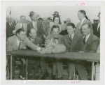 Amusements - Shows and Attractions - Frank Buck's Jungleland - Lions and Tigers - Johnny Weissmuller, Grover Whalen, Frank Buck and others with baby lion