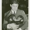 Amusements - Shows and Attractions - Frank Buck's Jungleland - Monkeys and Chimpanzees - Man with baby chimpanzees