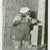 Amusements - Shows and Attractions - Frank Buck's Jungleland - Monkeys and Chimpanzees - Chimpanzee in costume with beer bottle