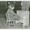 Amusements - Shows and Attractions - Frank Buck's Jungleland - Monkeys and Chimpanzees - Chimpanzee in costume on piano