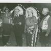 Amusements - Shows and Attractions - Wild West - Indian man putting headdress on Grover Whalen