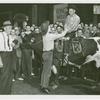 Amusements - Shows and Attractions - Wild West - Man on bull shaking hands with man on ground