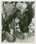 Amusements - Villages - Little Miracle Town - Midget cutting watermelon