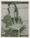 Amusements - Villages - Merrie England - Woman holding replica of Crown Jewels