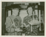 Amusements - Villages - Merrie England - Woman and guard holding Crown Jewels replicas