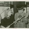 Amusements - Villages - Merrie England - Guard with woman holding replica of jeweled sword