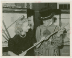 Amusements - Villages - Merrie England - Guard with woman holding replica of jeweled sword