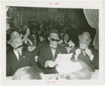 Amusements - Villages - Old New York - Men in fake mustaches at dinner