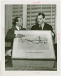 Amusements - Villages - Old New York - Grover Whalen holding sketch