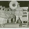 Amusements - Villages - Old New York - Showgirl being weighed