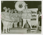 Amusements - Villages - Old New York - Showgirl being weighed