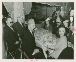 Amusements - Villages - Old New York - Men in fake mustaches at dinner