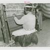 Amusements - Villages - Seminole Village - Man at loom with child