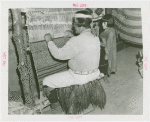 Amusements - Villages - Seminole Village - Man at loom with child