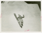 Amusements - Villages - Sun Valley - Girl with skis napping on roof