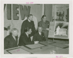 Apparel and Accessories Exhibit - Committee members showing Grover Whalen sketch of proposed building