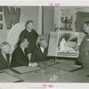Apparel and Accessories Exhibit - Committee members showing Grover Whalen sketch of proposed building
