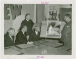 Apparel and Accessories Exhibit - Committee members showing Grover Whalen sketch of proposed building