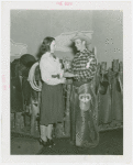 Arizona Participation - Cowboy showing girl branding iron