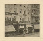 The Broadway Theatre, with posters announcing Julia Dean in The woman in white. Site 485 Broadway. Signboards of H. F. Shepher (Essex Hat M'f'g Co.) at 483, H. Knighton and Alfred Plunkett at 485, Lasell & Co. (hats) at 487.