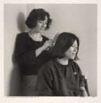 Mariana combing June's hair (Mariana Romo-Carmona and June Chan). NYC.