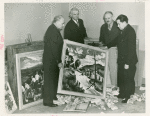 Art Exhibits - American Art Today - Committee members opening box of submissions