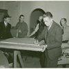 Art Exhibits - American Art Today - Man signing painting