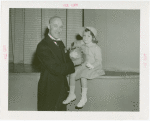 Australia Participation - L.R. MacGregor (Commissioner) presents koala bear to girl