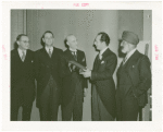 Australia Participation - L.R. MacGregor (Commissioner) presents copy of Australian constitution for exhibit